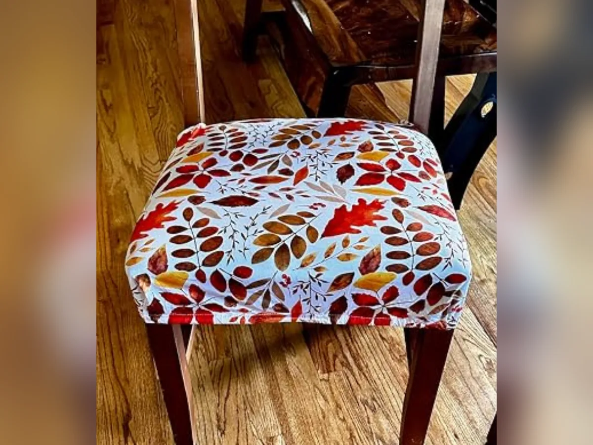 Fall leaf patterned stretch seat cover on a wooden dining chair